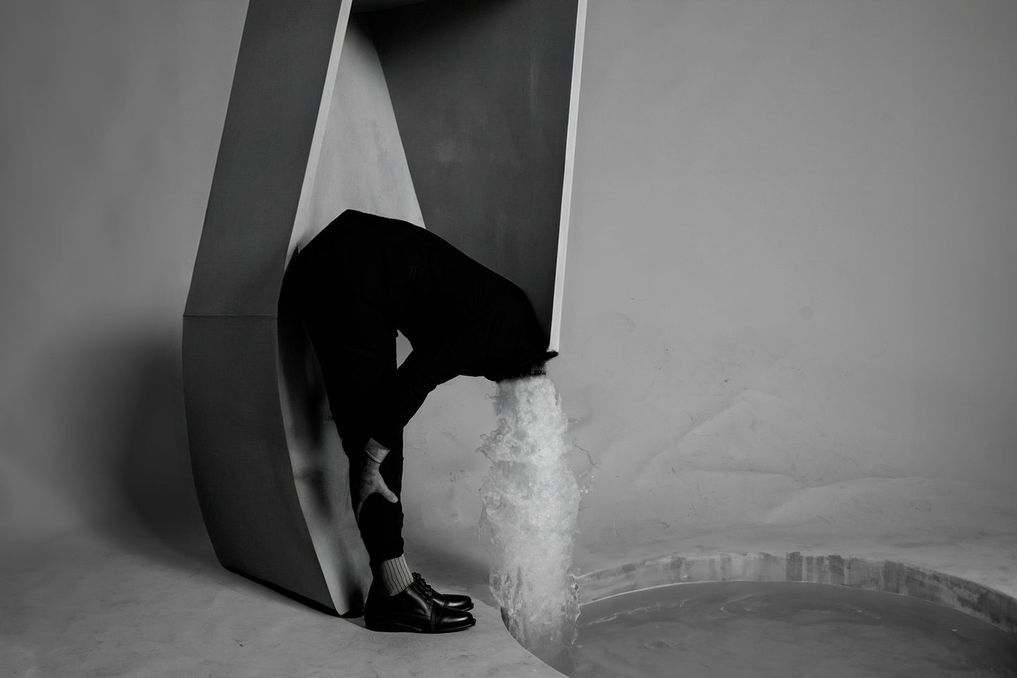 Fountain of Youth by Erin Naifeh - surreal black and white photography about aging with waterfall erupting from figure's neck