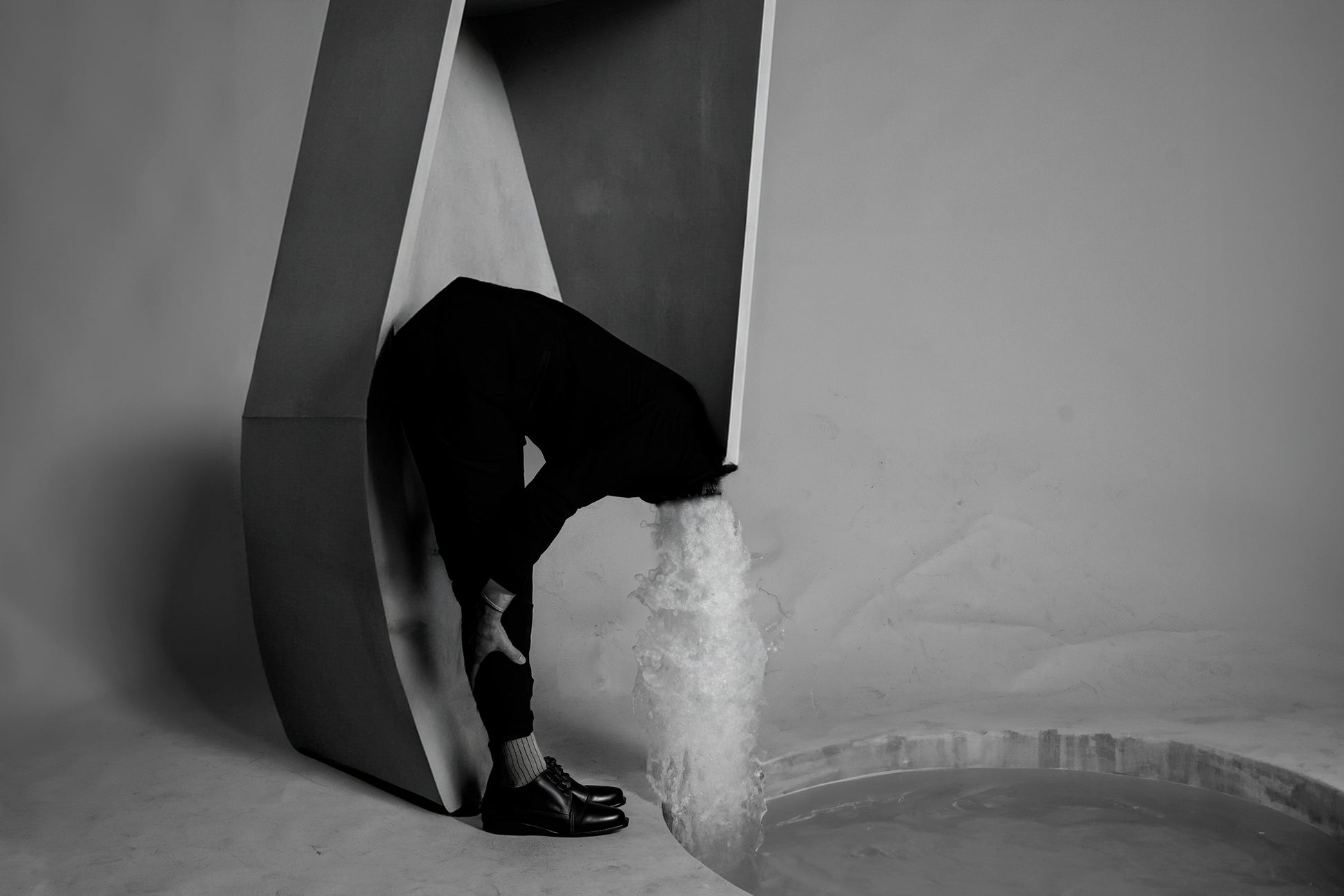 Fountain of Youth by Erin Naifeh - surreal black and white photography about aging with waterfall erupting from figure's neck